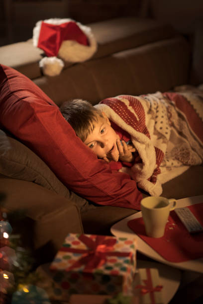istock Boy waiting for Santa on Christmas eve 1056620636