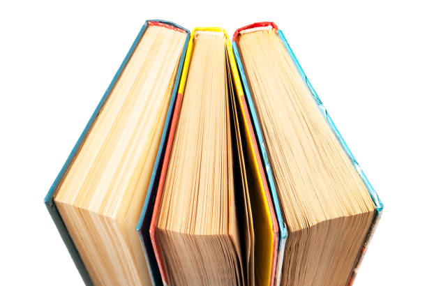 istock closed books stand next to isolated on white 1056621566