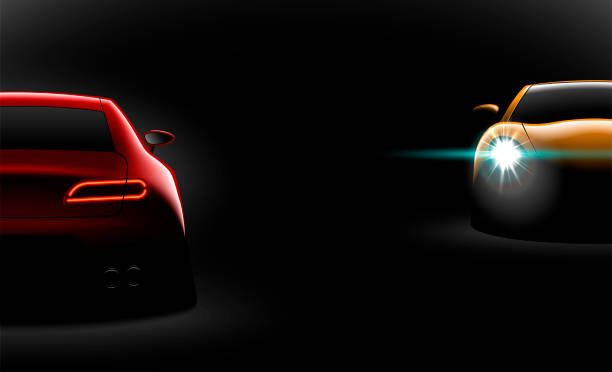 istock realistic red yellow two sport car view with unlocked headlights in the dark 1056623038