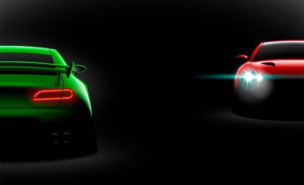 istock realistic red green two sport car view with unlocked headlights in the dark 1056623040