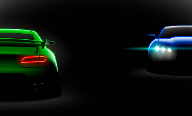 istock realistic green blue two sport car view with unlocked headlights in the dark 1056623042