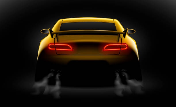 istock realistic yellow sport car back view with unlocked rear lights in the dark 1056623046