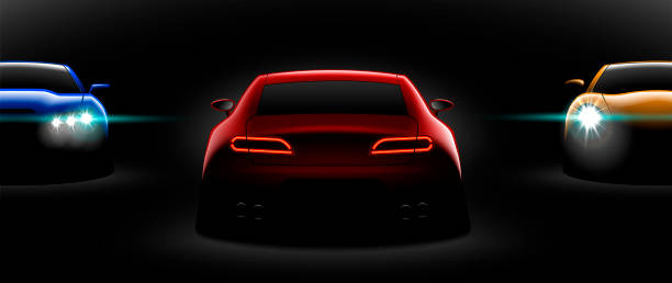 istock realistic red yellow blue three sport car view with unlocked headlights in the dark 1056623048