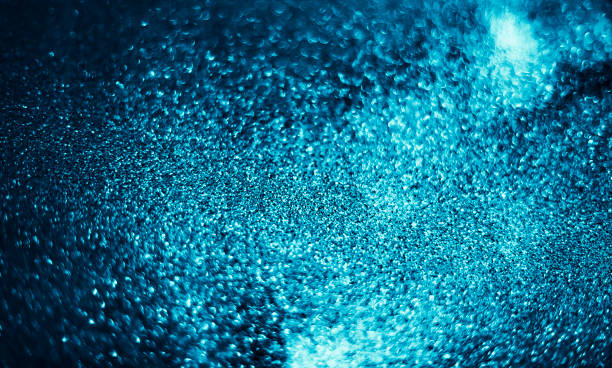 istock Abstract bokeh glitter background. Defocused background. Blurred bright light on black 1056623524