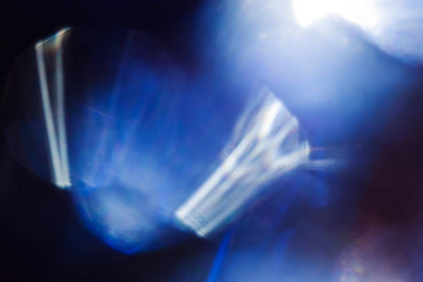 istock Blue smooth spots of light on black background 1056623912