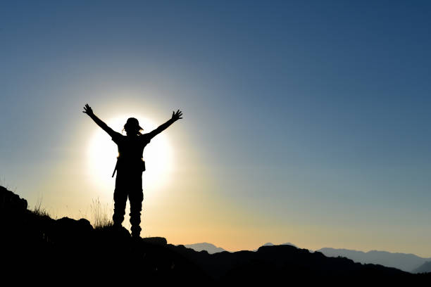 istock successful mountaineer on top and sunset time 1056625626