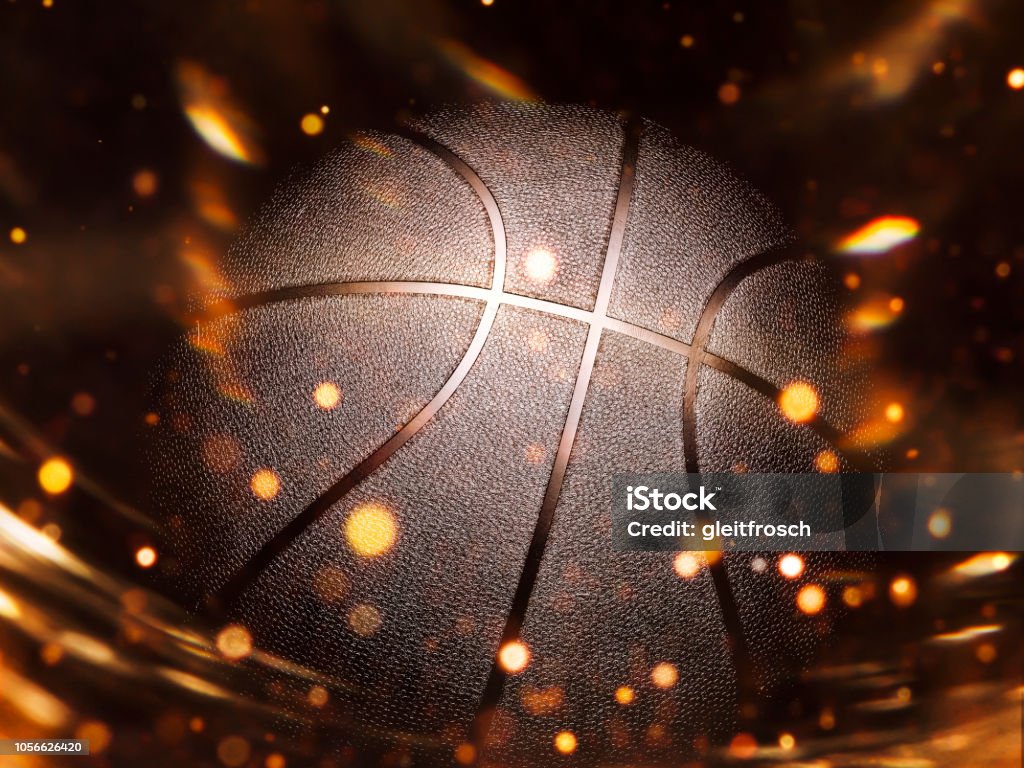 Basketball close-up on studio background - Stock image Basketball close-up on black background with bokeh, spotlights and fire Basketball - Sport Stock Photo