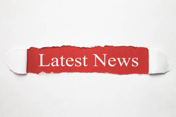 istock Latest News text on torn paper. Business concept 1056628426