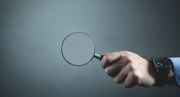 istock Hand showing magnifier. Business concept 1056628480