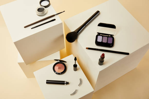istock high angle view of various makeup accessories on beige cubes 1056628840