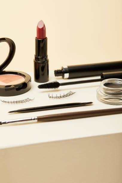 istock close-up shot of various makeup accessories on beige 1056628864