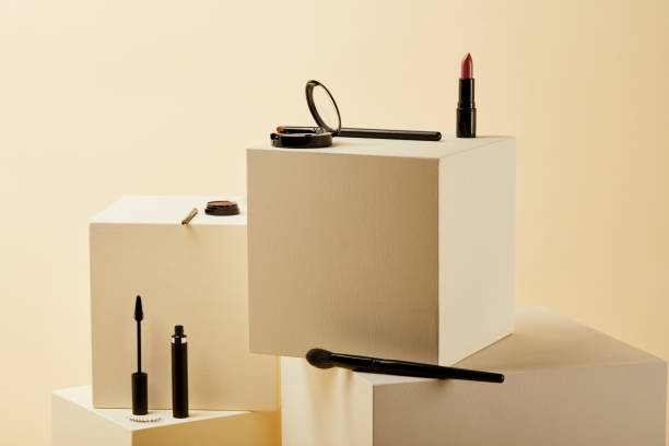 istock various makeup supplies lying on beige cubes 1056628916