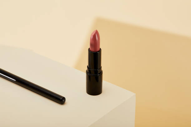 istock close-up shot of lipstick standing on beige surface 1056628926