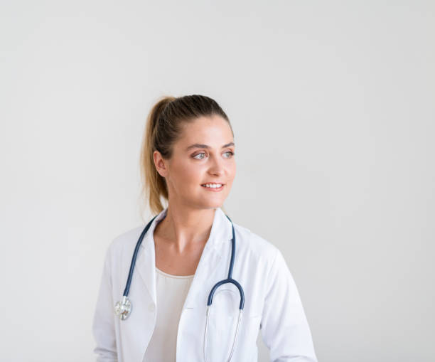 istock Thoughtful young female doctor looking away 1056630440