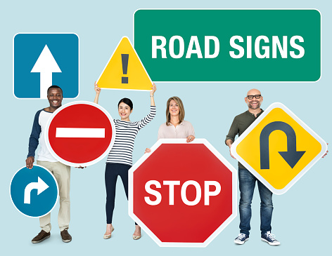 Happy diverse people holding road signs\n\n***These graphics are derived from our own 3D generic models. They do not infringe on any copyright design.***