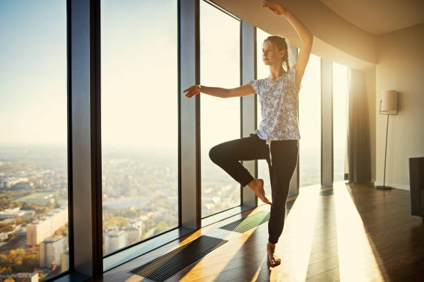 Teenage practicing dancing at modern apartment