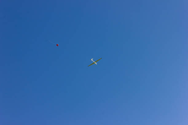 istock glider at winch start on blue sky in south germany 1056641254