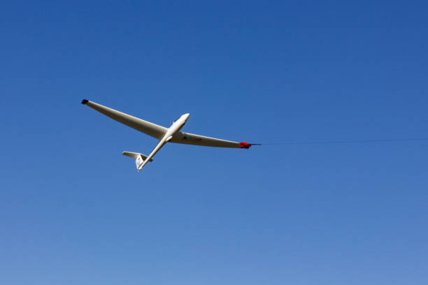 istock glider at winch start on blue sky in south germany 1056641398