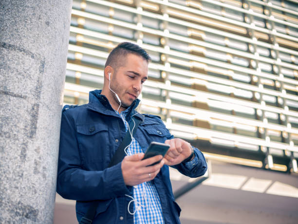 istock Businessman using a phone in city 1056644212