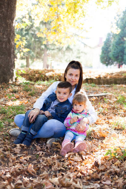 istock mother and children embracing 1056644276