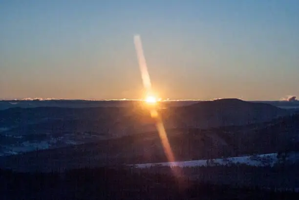 sunrise from Ochodzita hill above Koniakow village in Beskid Slaski mountains in Poland during freezing winter day