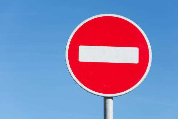 istock Round road stop sign, on a pole against the sky. 1056650268