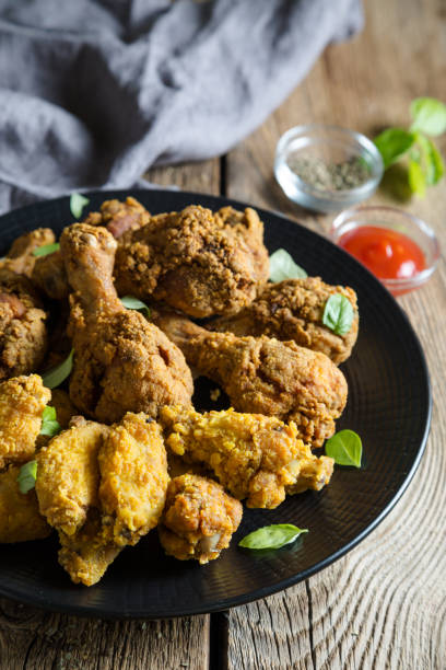 istock Fried Chicken Wings and Chicken Legs 1056651478