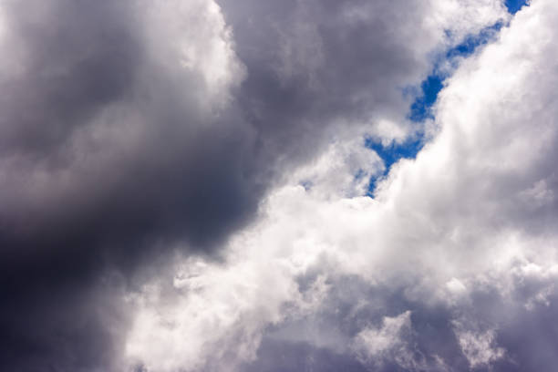 istock dense and great white clouds on a beautiful summer blue sky 1056651664
