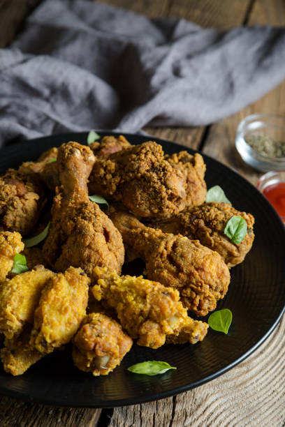 istock Fried Chicken Wings and Chicken Legs 1056651688