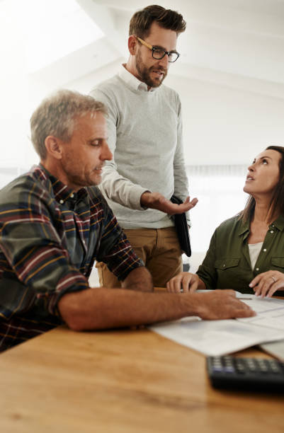 istock Explaining it all in detail to his clients 1056654108