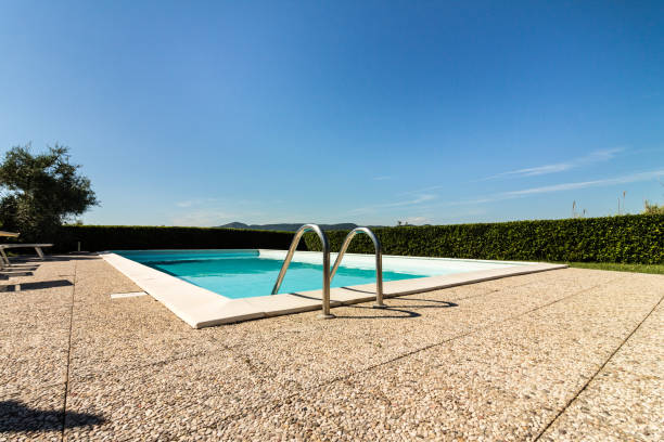 Swimmingpool in front of a blue sky stock photo