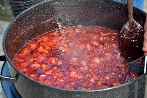 istock Cooking jam and compote in the backyard 1056659730