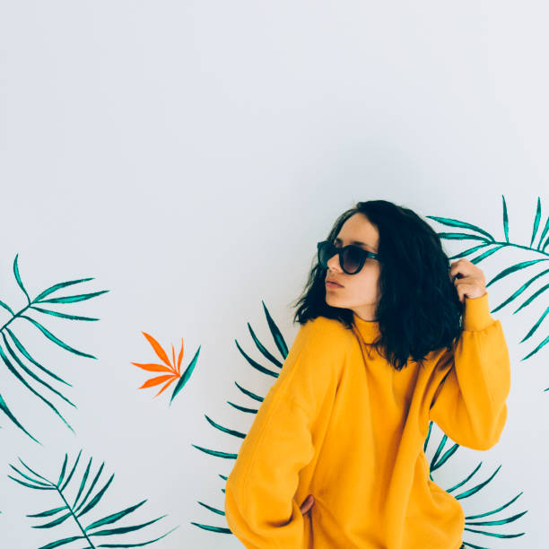 istock Pretty woman in sunglasses and sweatshirt. 1056662720