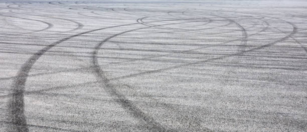 istock Car track asphalt pavement background at the circuit 1056663770