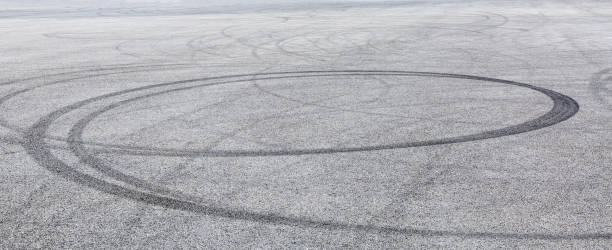 istock Car track asphalt pavement background at the circuit 1056665490