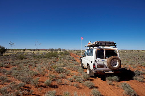 The Talawana Track, Western Australia - August 12, 2010: A 4WD off road vehicle is stopped on the remote Talawana Track in the Gibson Desert in outback Western Australia.