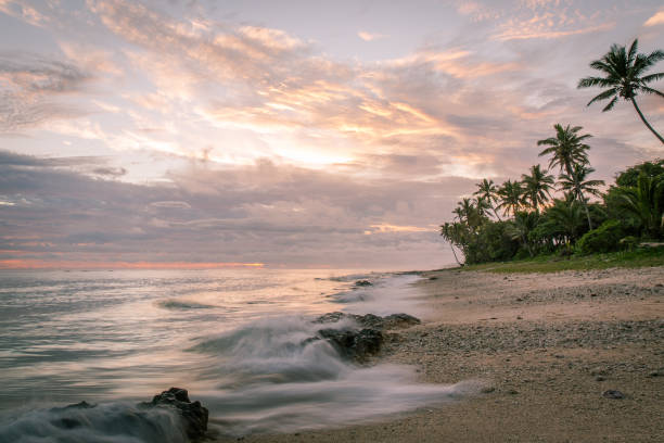 istock Long exposure caption of sea waves on the shore during sunset 1056667348
