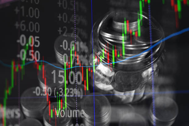 istock Double exposure of coin stack with stock market screen chart board and candle stick for financial business and investor analysis concept. 1056667808