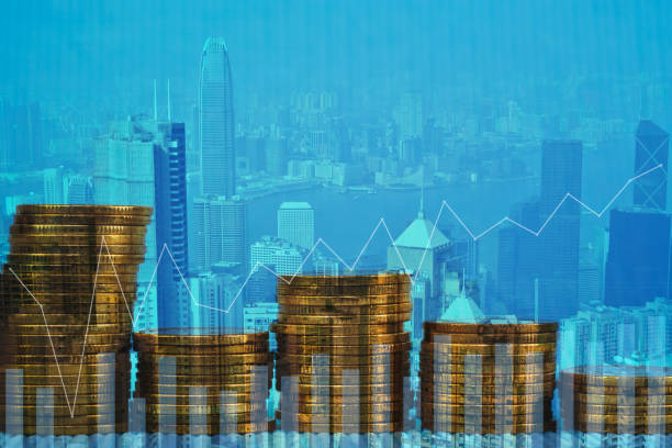 istock Double exposure Stack of coin with financial graph over city and office building background, business and financial concept. 1056667934