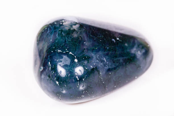 istock Macro mineral stone Agate mossy (India) on a white background 1056668502