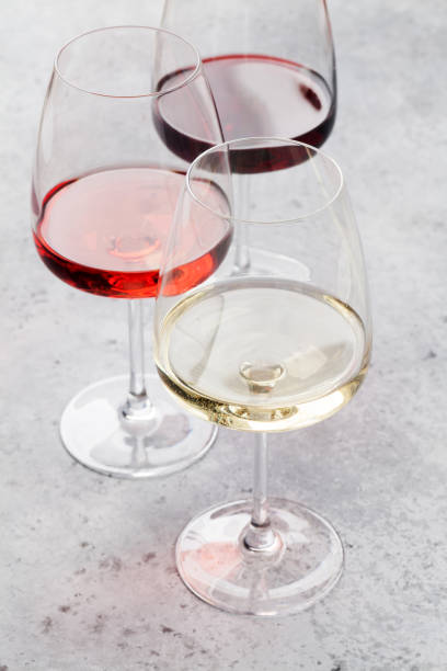 istock Red, rose and white wine glasses 1056669498