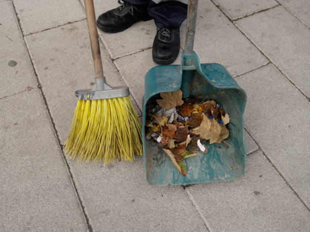 istock Cleaning street with broom and shovel 1056674028