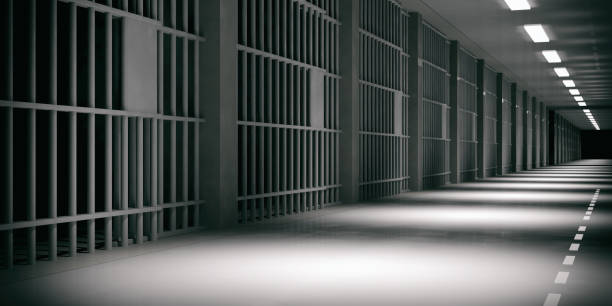 istock Prison interior. Jail cells, dark background. 3d illustration 1056675130