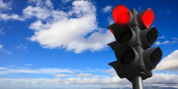 Photo of Red traffic lights on blue sky background, copy space. 3d illustration