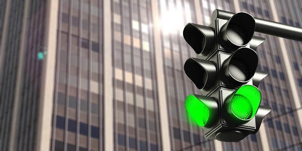 Green light concept.Traffic light, green go signal, on business office building background, copy space. 3d illustration