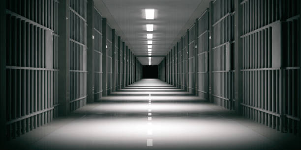 istock Prison interior. Jail cells, dark background. 3d illustration 1056675180