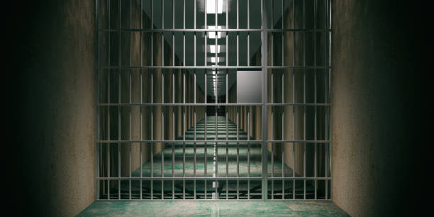 istock Prison interior. Jail cells, dark background. 3d illustration 1056675200