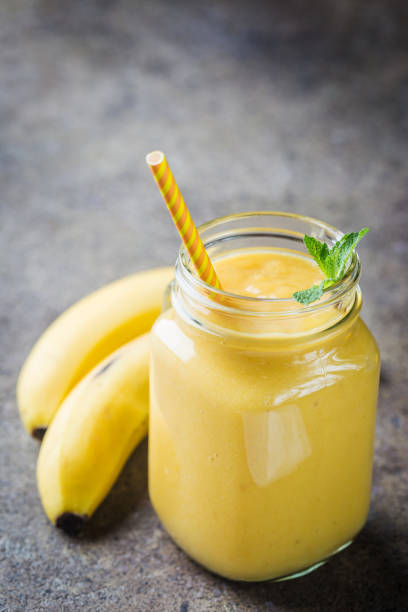 istock Banana smoothie in mason jars 1056675390