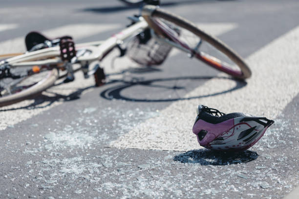 istock Helmet and bicycle on pedestrian crossing after traffic accident 1056676810
