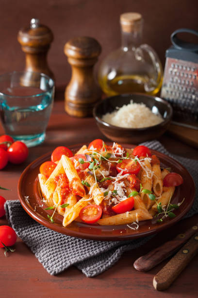 istock veggie penne pasta with tomatoes parmesan thyme 1056676980